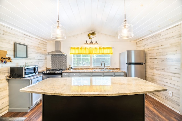 292 Burkhart Rd, Rutledge, TN 37861 - kitchen with stainless steel appliances, wall chimney exhaust hood, wood walls, dark wood-style floors, and light stone countertops