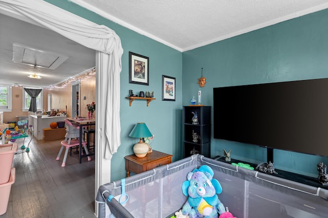 323 Pauline Ave, Morristown, TN 37813 - living area with attic access, crown molding, wood-type flooring, and a textured ceiling