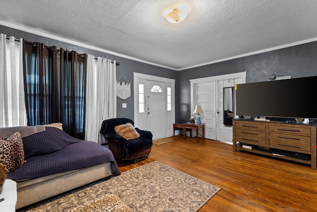 323 Pauline Ave, Morristown, TN 37813 - living room with wood finished floors, a textured ceiling, and ornamental molding