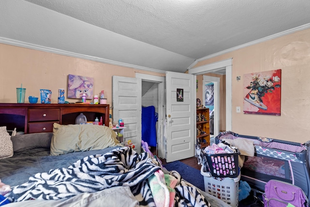 323 Pauline Ave, Morristown, TN 37813 - bedroom featuring lofted ceiling, crown molding, wood finished floors, and a textured ceiling