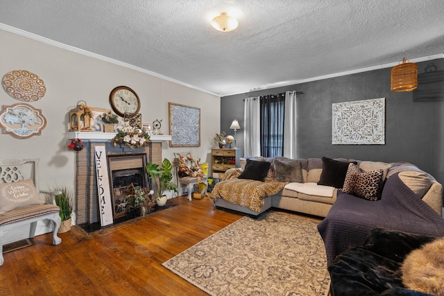 323 Pauline Ave, Morristown, TN 37813 - living area featuring a textured ceiling, wood finished floors, a fireplace, and crown molding