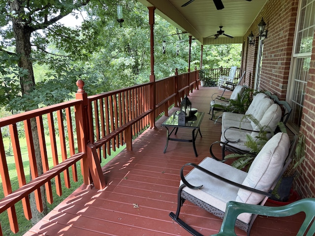 wooden terrace with ceiling fan and a porch