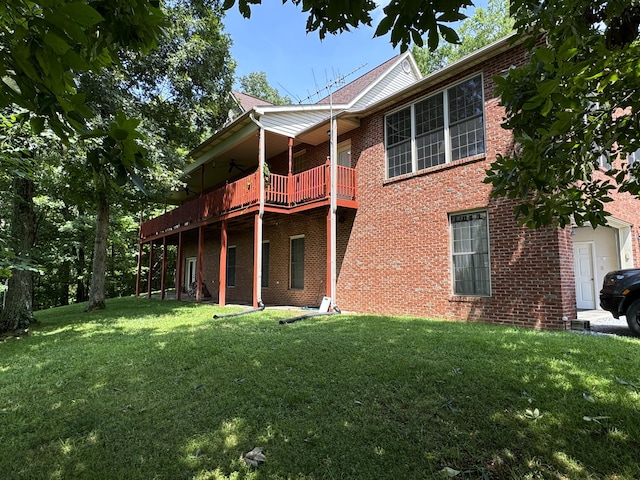 back of house with a yard and a deck