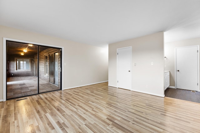 unfurnished room featuring light wood-type flooring