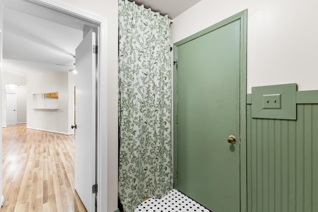 bathroom featuring hardwood / wood-style flooring and ceiling fan