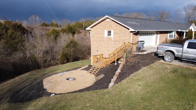 view of home's exterior with a garage and a lawn