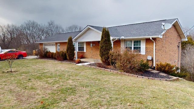 view of front of house featuring a garage and a front yard