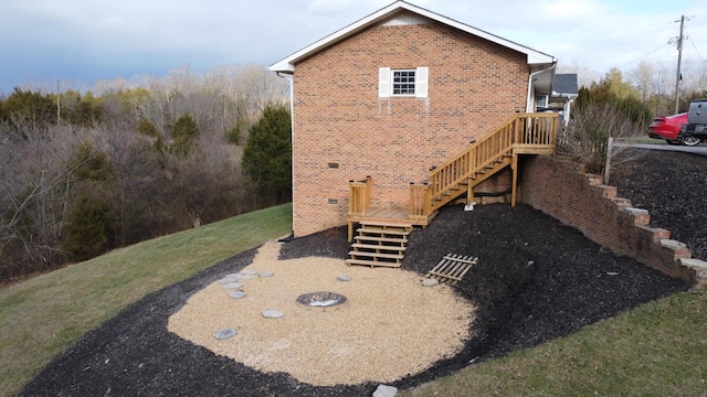 rear view of house with a fire pit