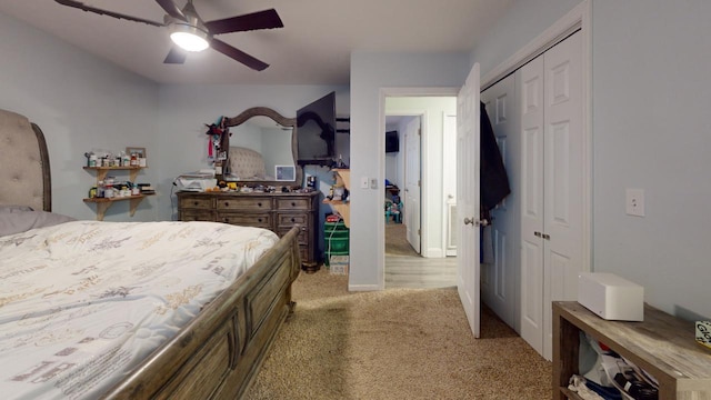 bedroom with light colored carpet, a closet, and ceiling fan