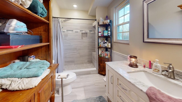 bathroom with vanity, toilet, tile patterned flooring, and a shower with shower curtain