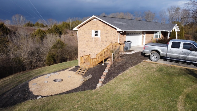 view of side of property with a garage and a lawn