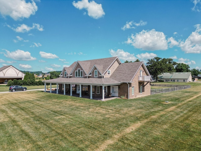 view of front of property with a patio area and a front yard