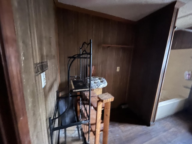 dining room with wood walls