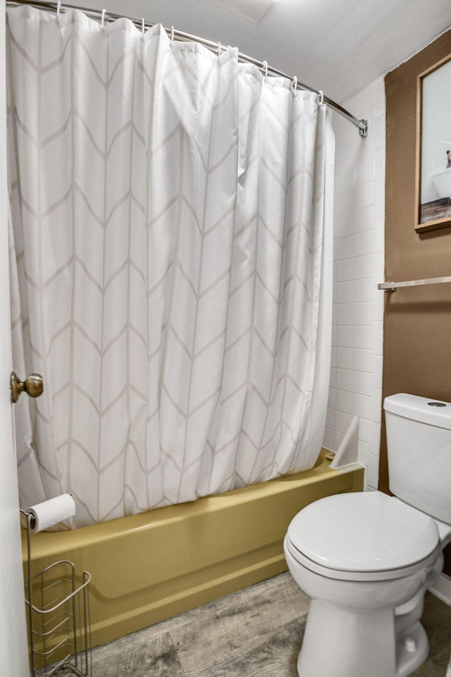 full bath featuring toilet and shower / tub combo