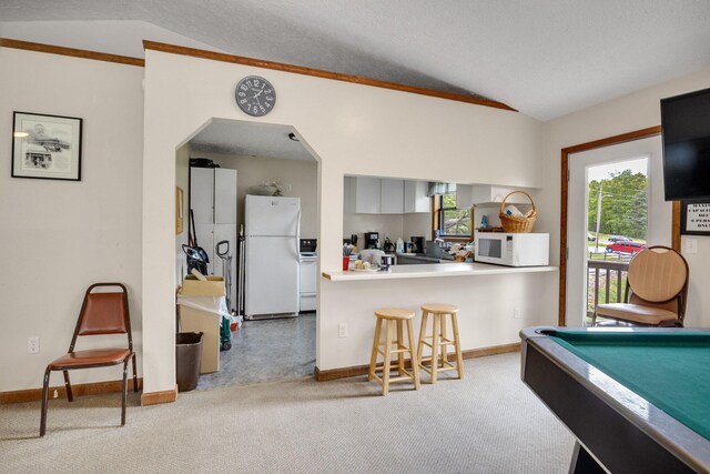 rec room featuring vaulted ceiling, carpet, baseboards, and billiards table