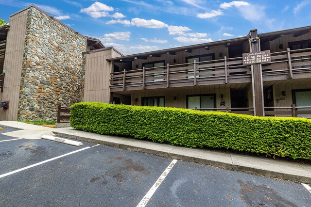 view of property with uncovered parking