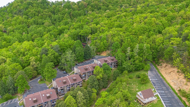 aerial view of property's location with a forest