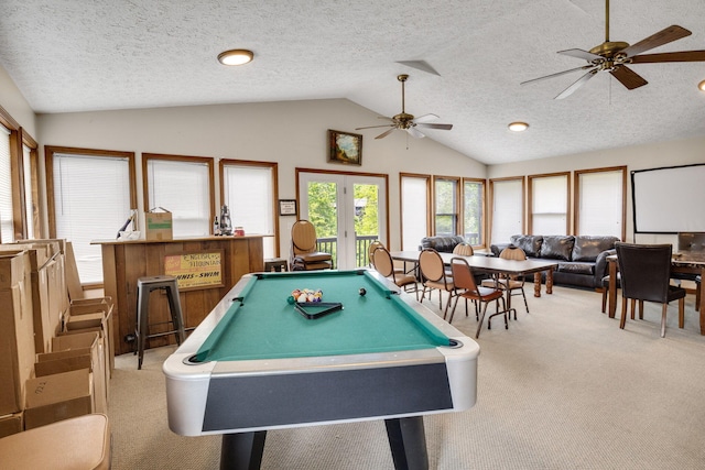 recreation room featuring carpet floors, ceiling fan, lofted ceiling, a textured ceiling, and pool table