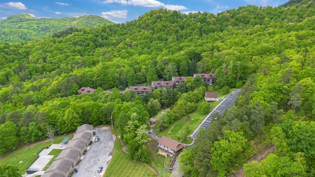 aerial overview of property's location featuring a heavily wooded area