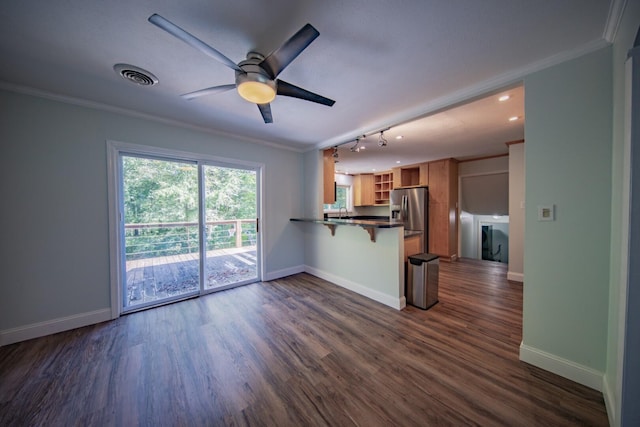 unfurnished living room with ceiling fan, a fireplace, dark hardwood / wood-style flooring, and crown molding