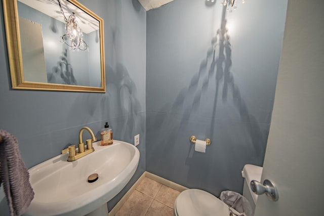 bathroom featuring tile patterned floors, sink, and toilet