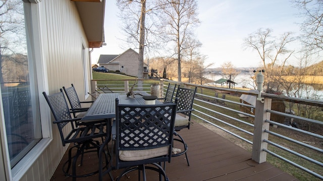 wooden deck featuring a water view