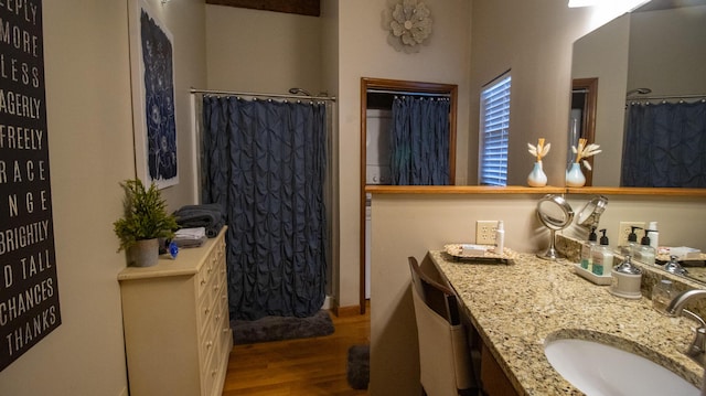 bathroom featuring hardwood / wood-style flooring and vanity