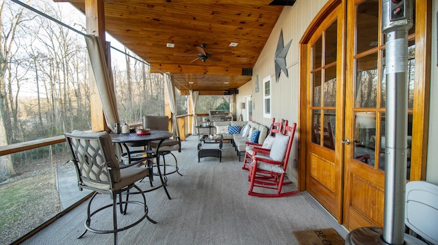 exterior space featuring an outdoor hangout area, ceiling fan, and french doors