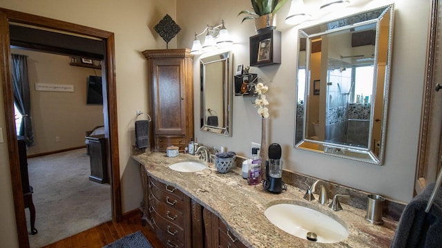 bathroom with vanity and hardwood / wood-style flooring