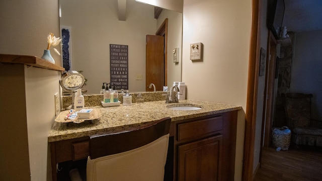 bathroom featuring vanity and hardwood / wood-style floors