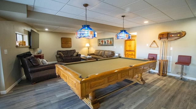 playroom with dark hardwood / wood-style flooring, pool table, and a paneled ceiling