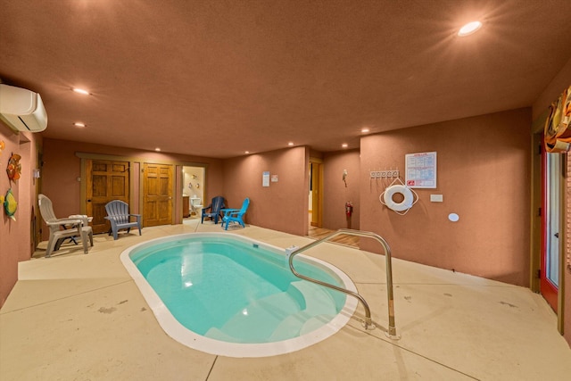 view of pool with a wall mounted air conditioner and a hot tub