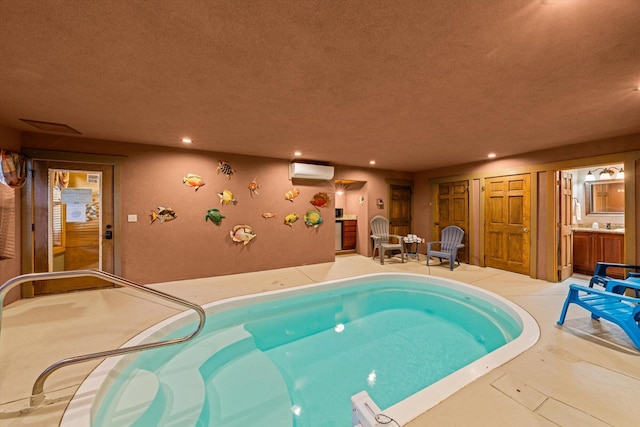 view of swimming pool featuring a wall unit AC and a hot tub