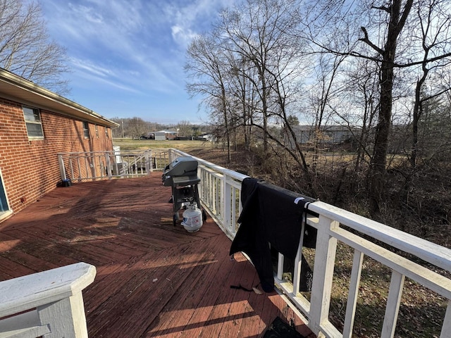wooden terrace with area for grilling
