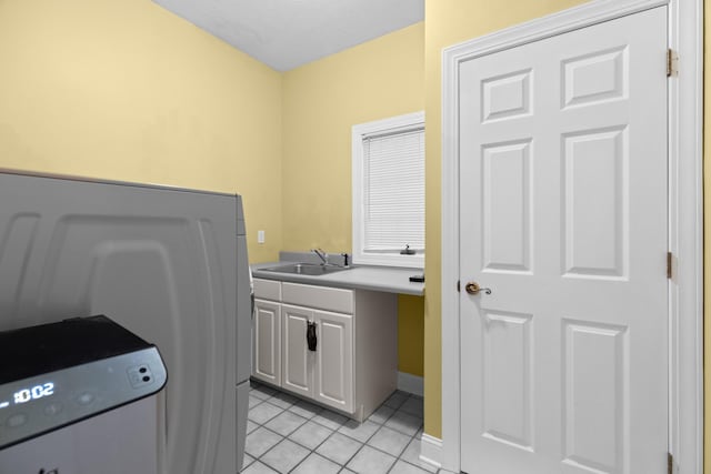 1647 Talon Ct, Talbott, TN 37877 - clothes washing area with cabinet space, light tile patterned floors, and baseboards