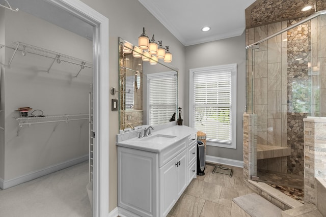1647 Talon Ct, Talbott, TN 37877 - bathroom featuring a stall shower, baseboards, crown molding, vanity, and a walk in closet