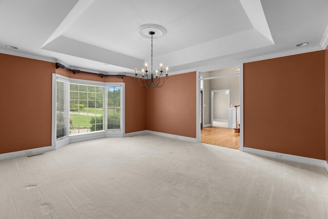 1647 Talon Ct, Talbott, TN 37877 - empty room featuring a tray ceiling, a chandelier, light colored carpet, baseboards, and crown molding