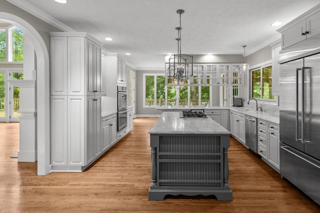 1647 Talon Ct, Talbott, TN 37877 - kitchen featuring appliances with stainless steel finishes, ornamental molding, recessed lighting, healthy amount of natural light, and light stone counters