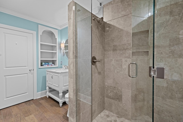1647 Talon Ct, Talbott, TN 37877 - bathroom with a stall shower, crown molding, vanity, wood finished floors, and toilet