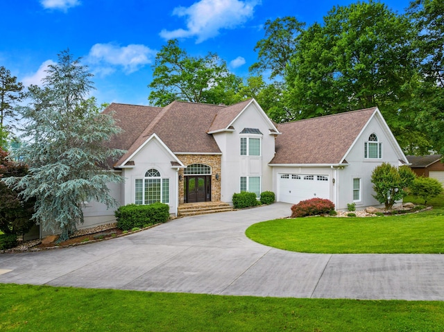 1647 Talon Ct, Talbott, TN 37877 - view of front facade with stucco siding, stone siding, concrete driveway, and a front yard