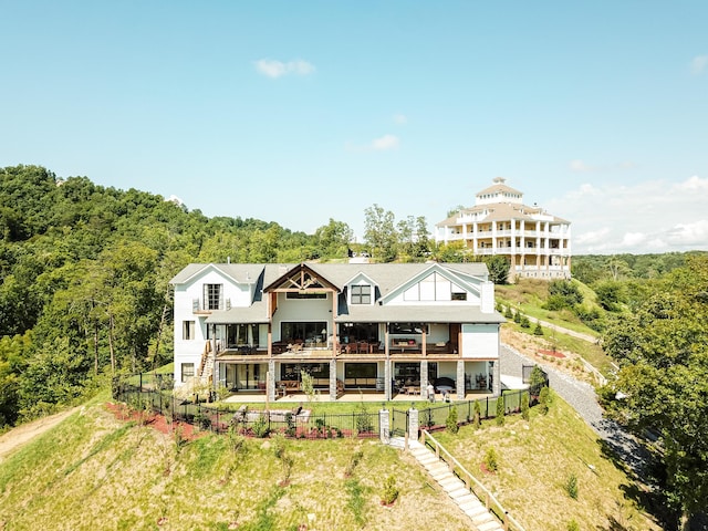 back of house with a balcony