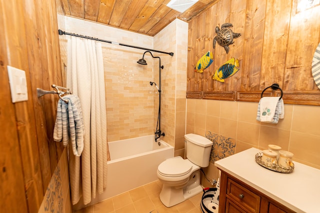 bathroom with wooden ceiling, tile patterned flooring, toilet, shower / bath combo with shower curtain, and tile walls