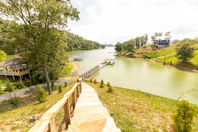 property view of water with a dock