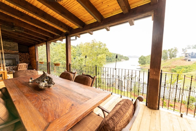 wooden deck with a water view