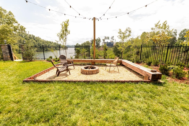 view of yard featuring an outdoor fire pit