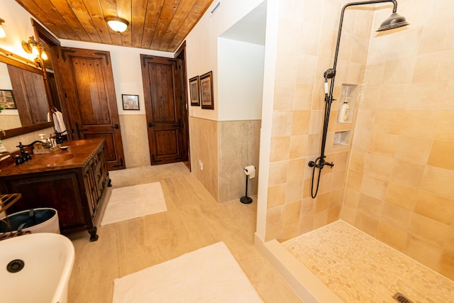 bathroom featuring plus walk in shower, vanity, wood walls, and wood ceiling