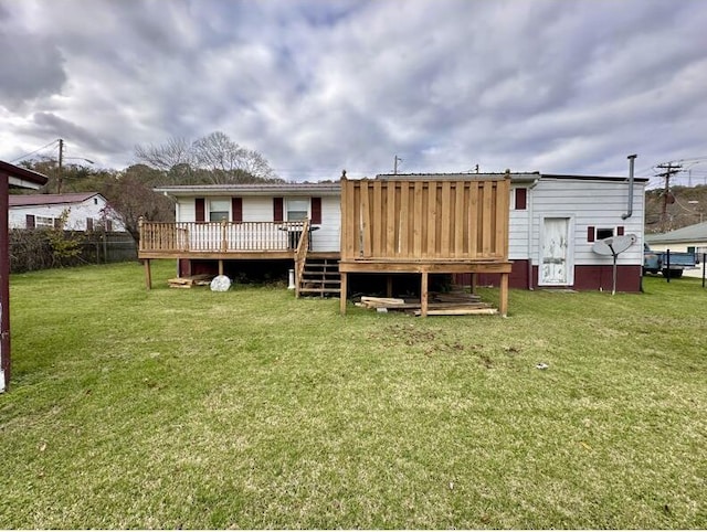 back of house featuring a yard and a deck