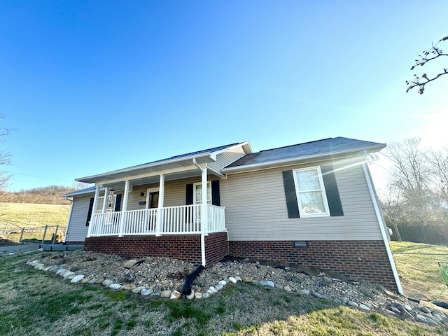 ranch-style house featuring crawl space and a porch