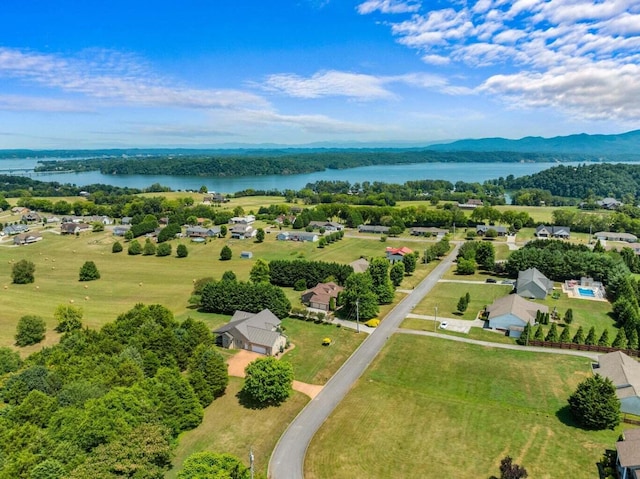 aerial view featuring a water and mountain view