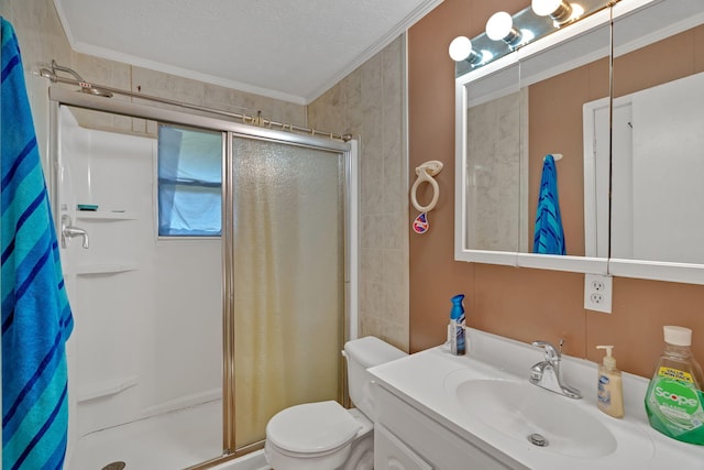 bathroom featuring a textured ceiling, toilet, a shower with door, vanity, and ornamental molding